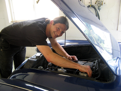 alex kramer fixing a vintage car